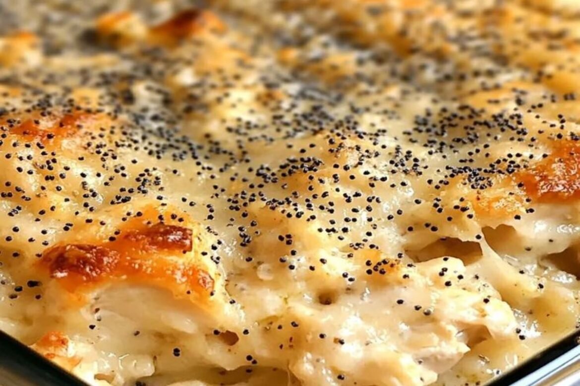 Creamy poppy seed chicken casserole with crispy Ritz cracker topping served in baking dish